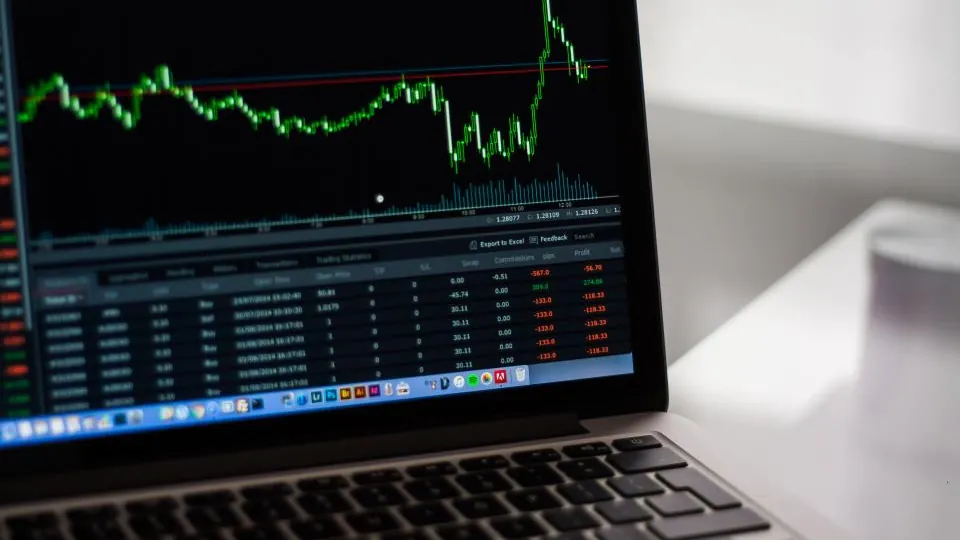 Laptop showing a price chart and market data